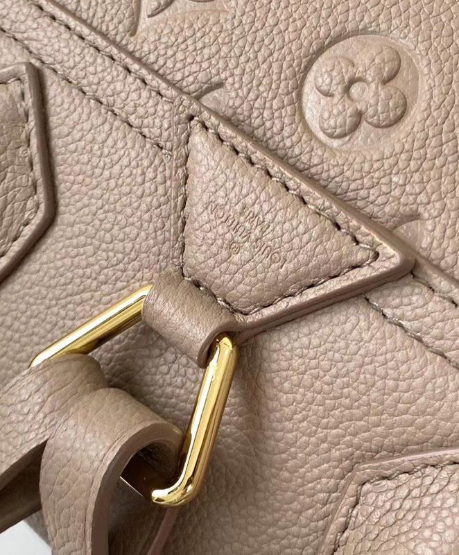 L.*V Exclusive, Montsouris Backpack M45205, Monogram Empreinte, vintage-style golden buckle, L.*V charm, embossed leather backpack.